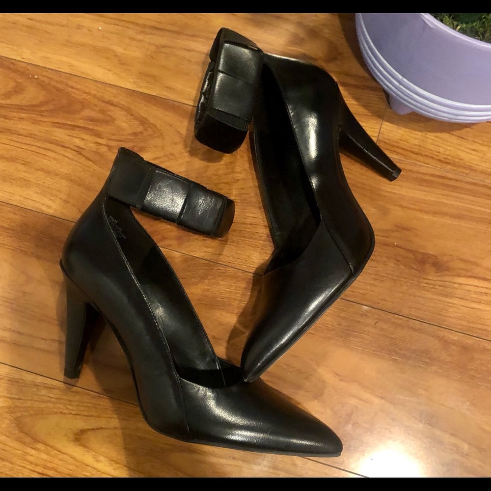 Black leather pumps